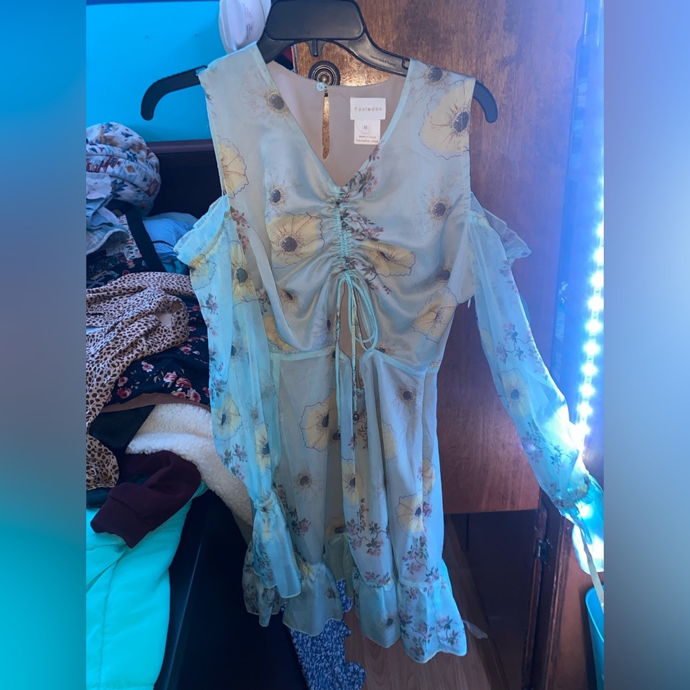 Very cute dress with cut outs looks great styled with boots
